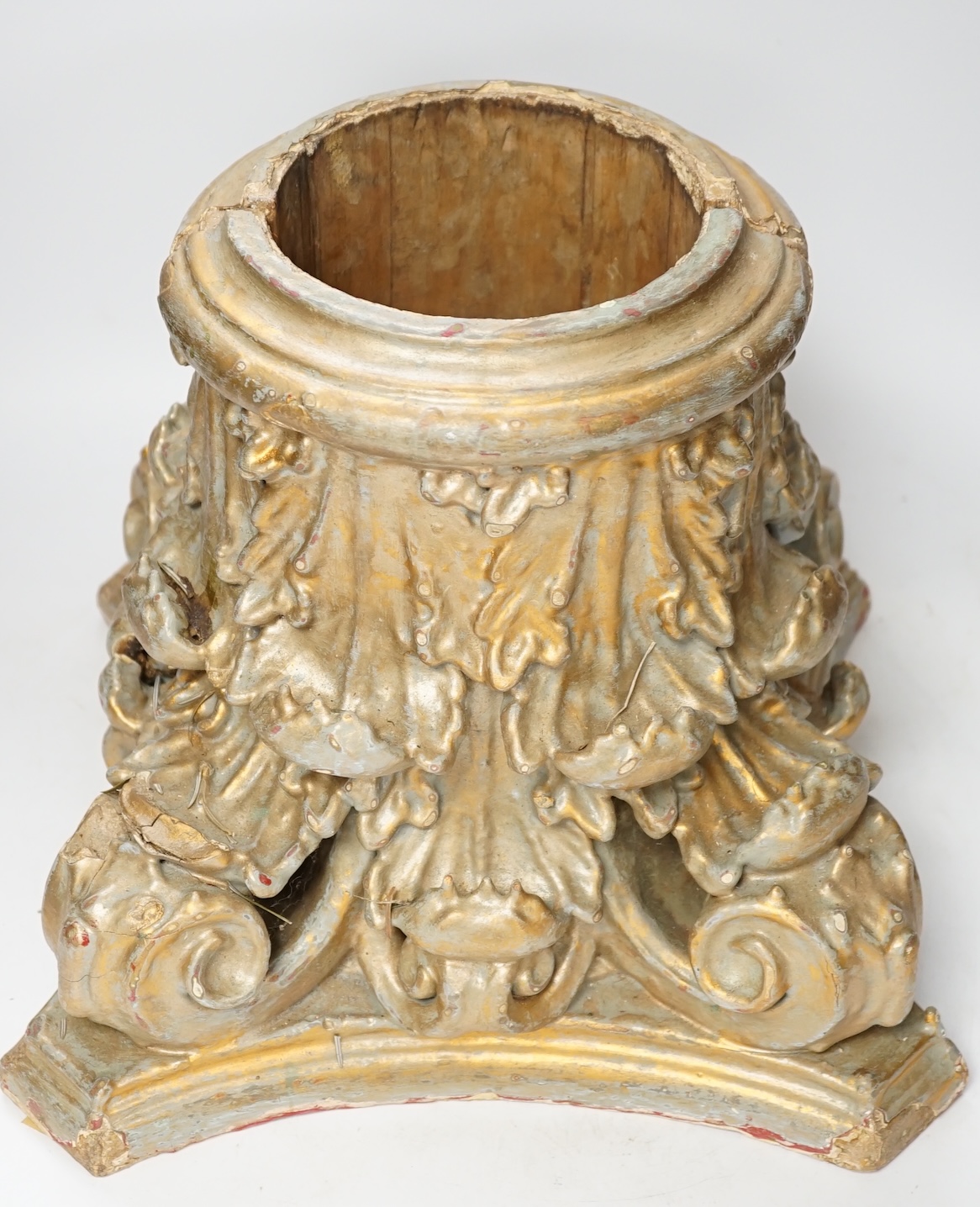A carved wood and gesso gilt column base in two sections, 28cm high. Condition- fair